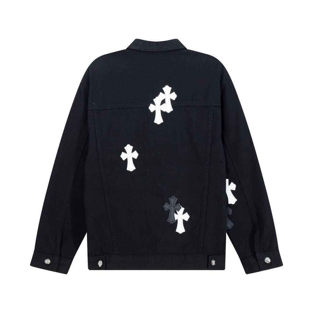 Black denim jacket back view with white cross patches and a small logo detail