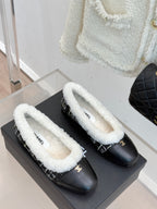 Pair of women’s Chanel loafers, black uppers with white sherpa lining and tweed trim