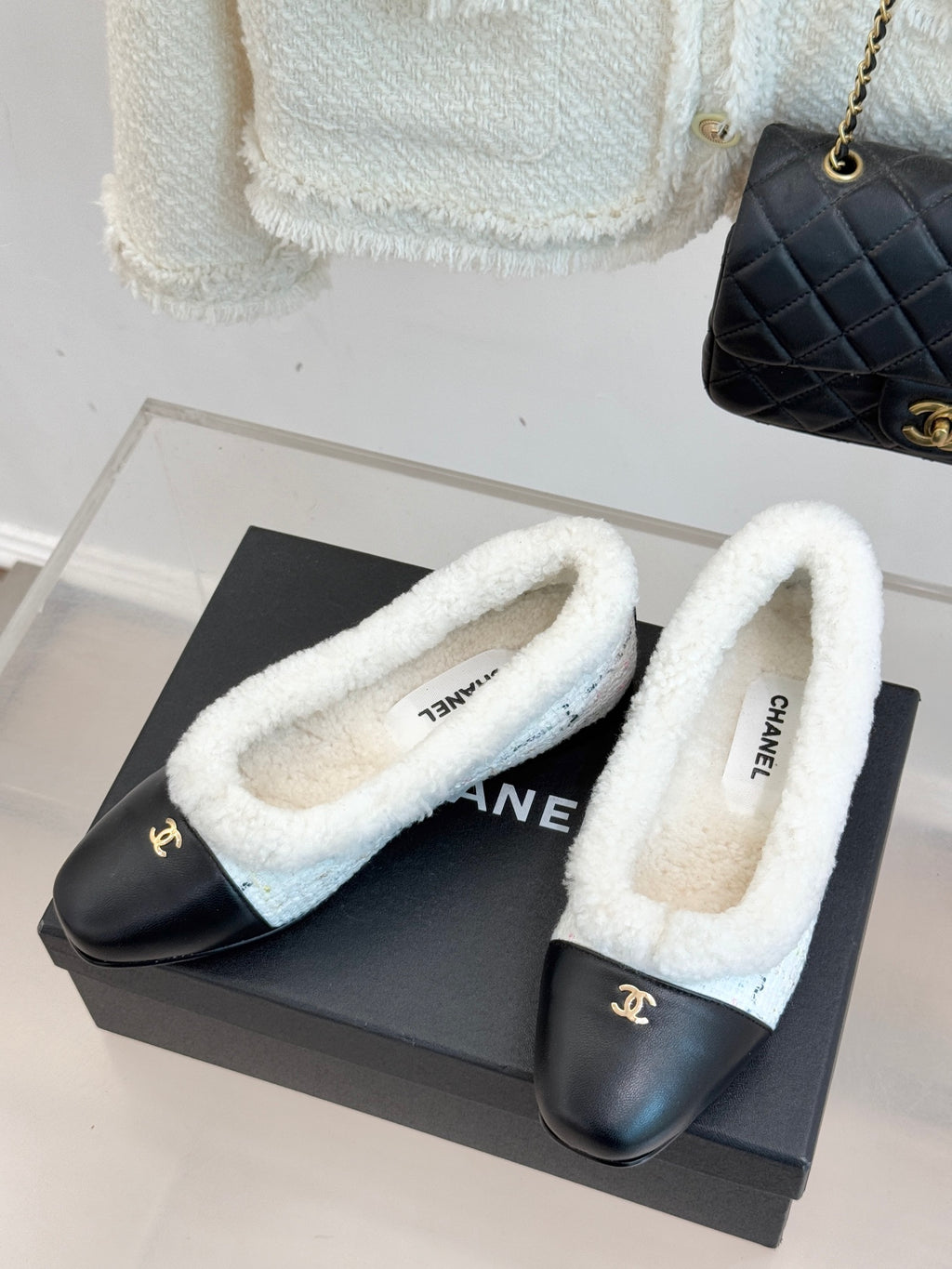 Women's Chanel shearling flats, black uppers with light blue fuzzy lining