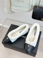 Women's Chanel shearling flats, black uppers with light blue fuzzy lining