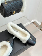 Women's Chanel slip-on flats with black leather and light blue shearling lining