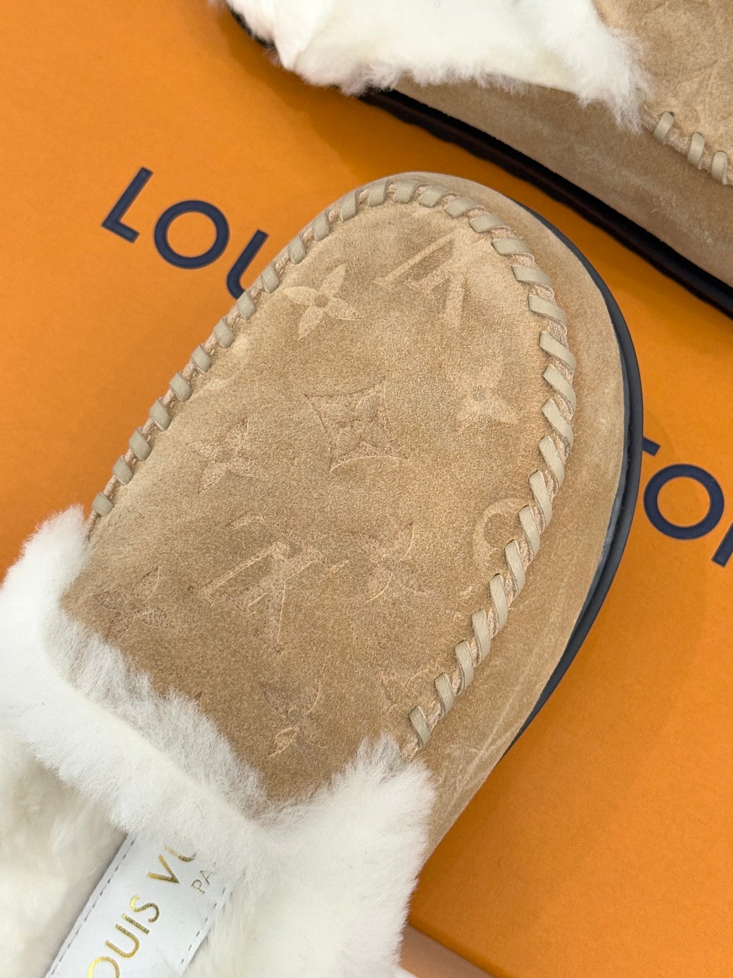 Louis Vuitton ladies shearling loafer, tan textured suede with white faux-fur edge
