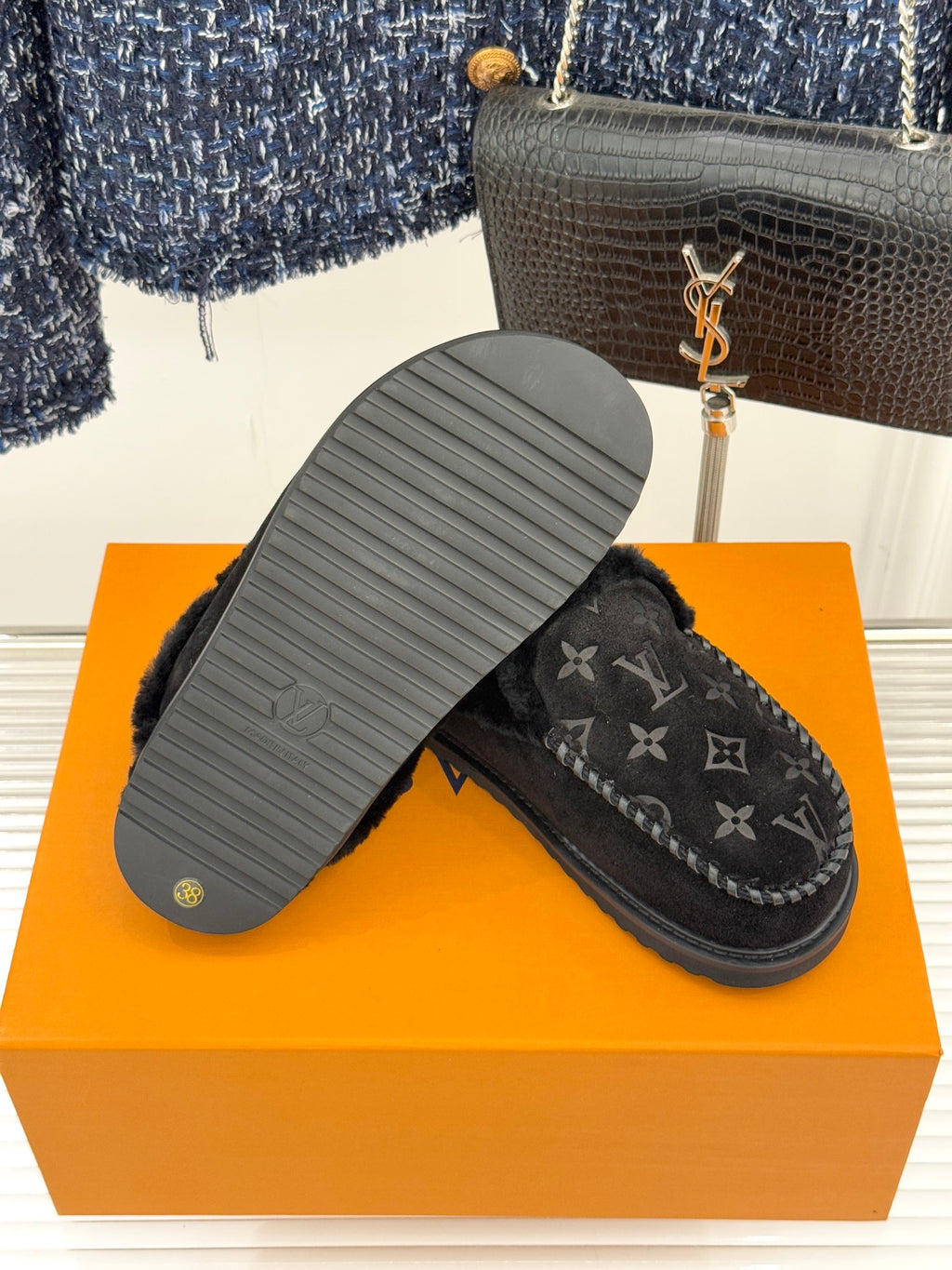 Louis Vuitton black monogram loafers with visible outsole tread