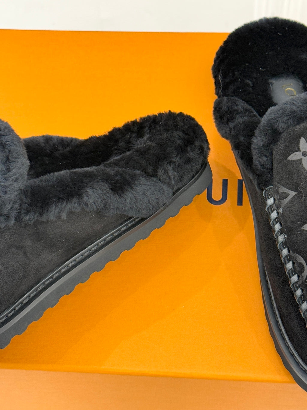 Louis Vuitton black monogram slip-on loafer with textured side trim