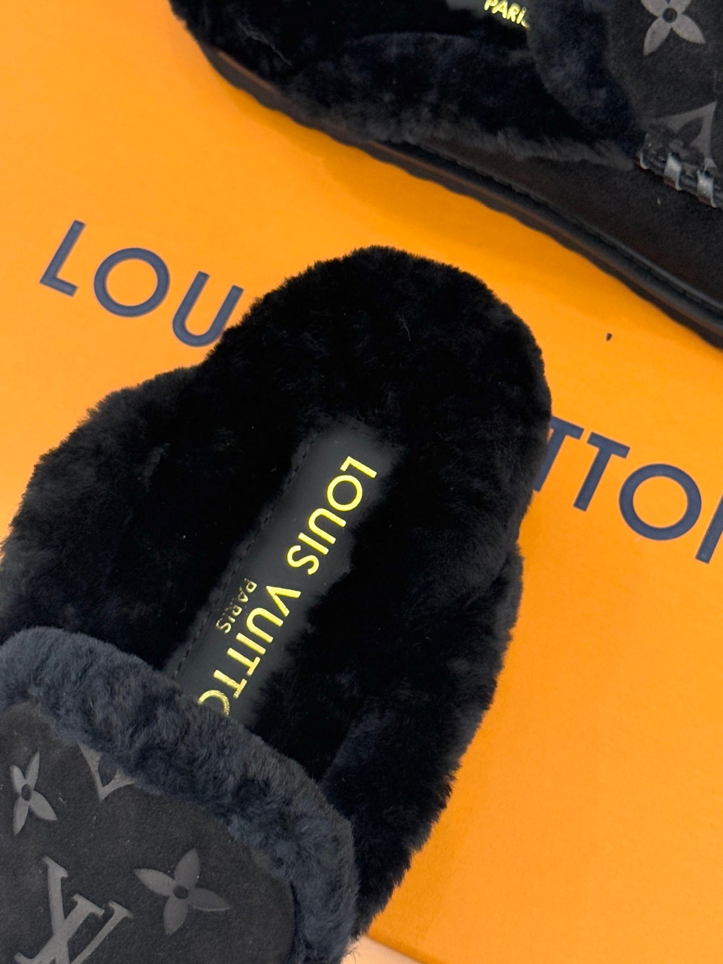 Louis Vuitton black shearling-lined loafer with yellow “Louis Vuitton” print