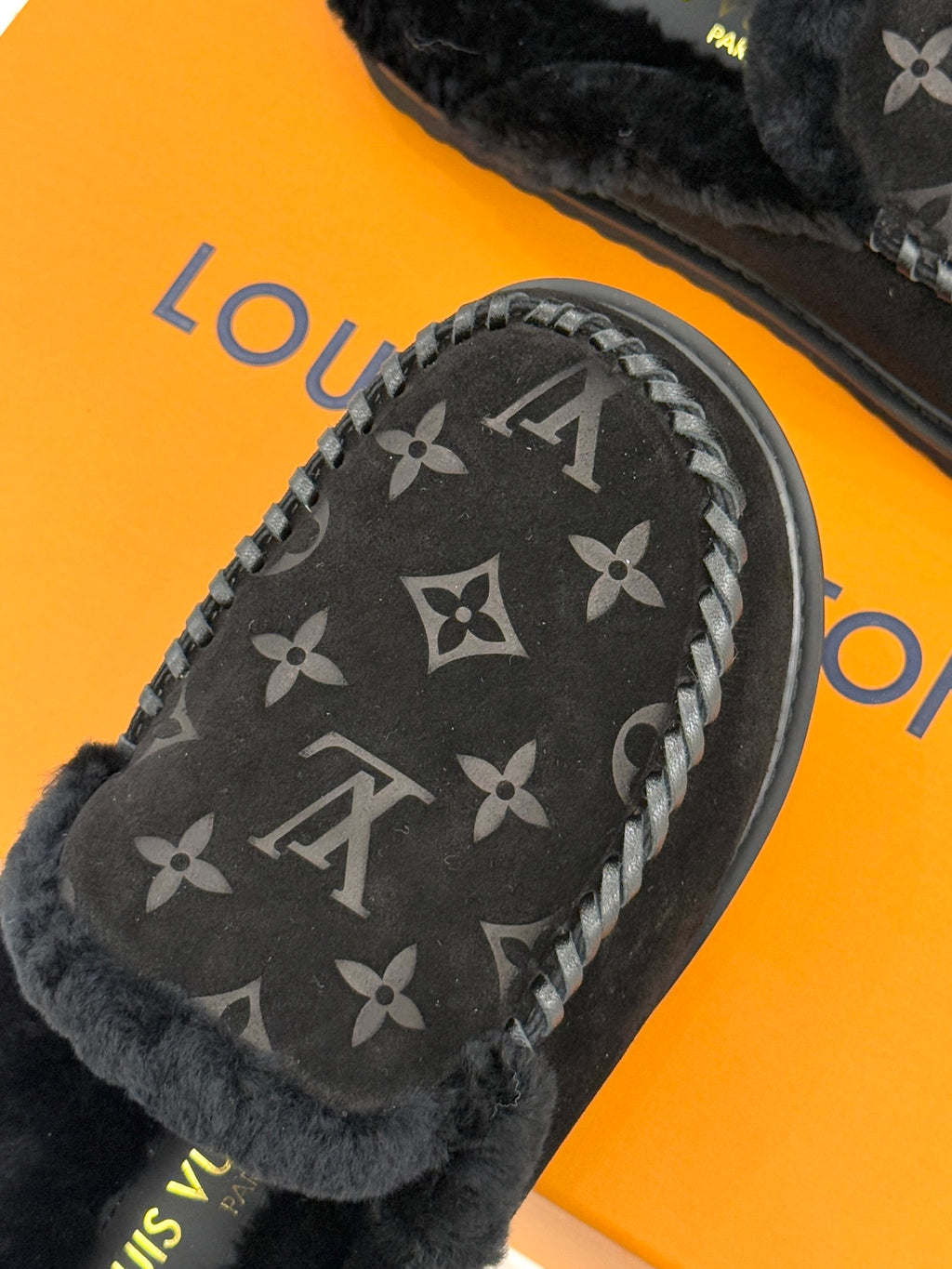 Louis Vuitton black monogram loafer with stitched lace trim and shearling