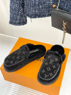 Pair of Louis Vuitton black monogram loafers with fuzzy shearling lining