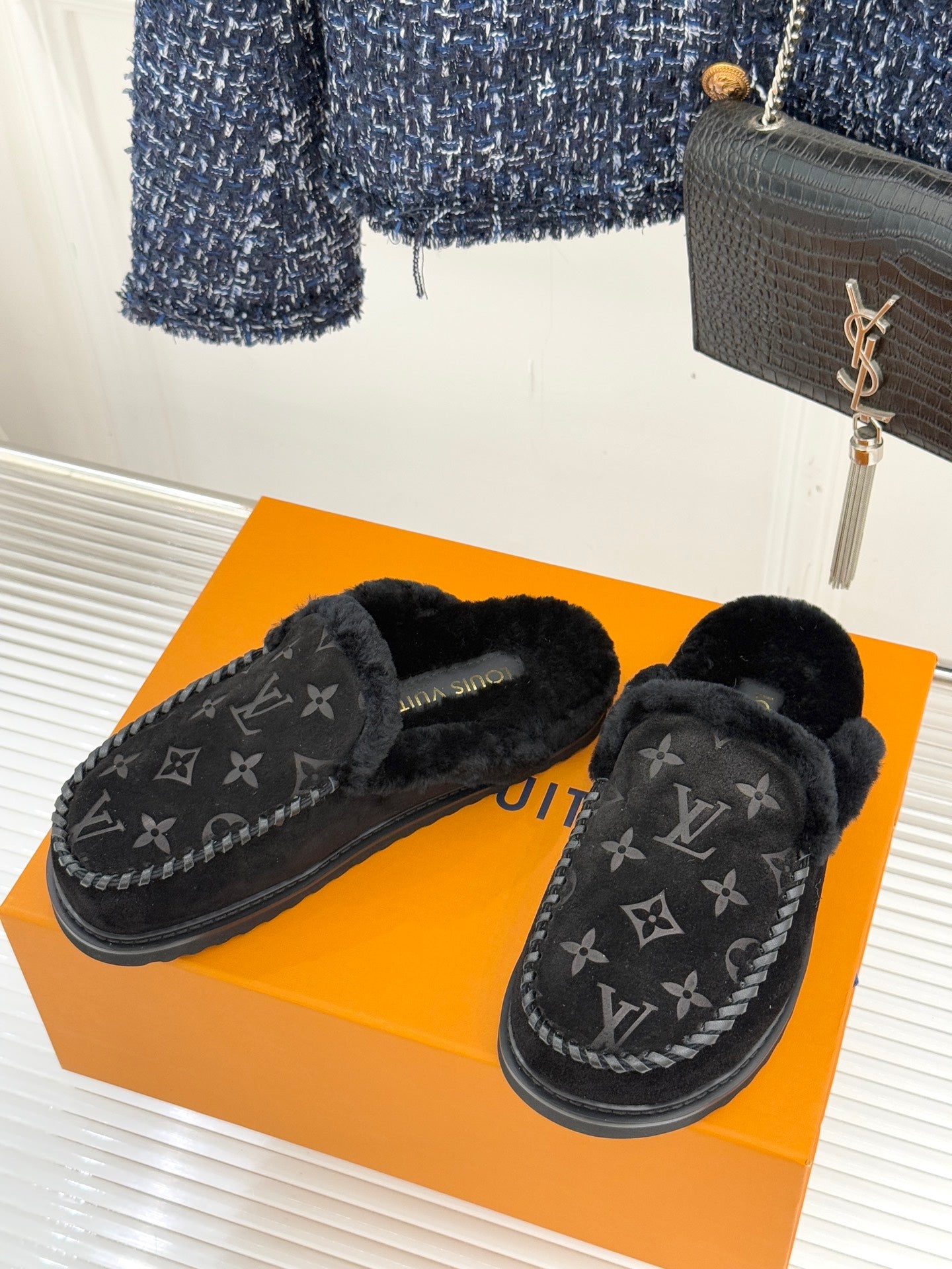 Pair of Louis Vuitton black monogram loafers with fuzzy shearling lining