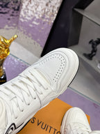 White Louis Vuitton high-top sneaker side profile with perforated toe and laces