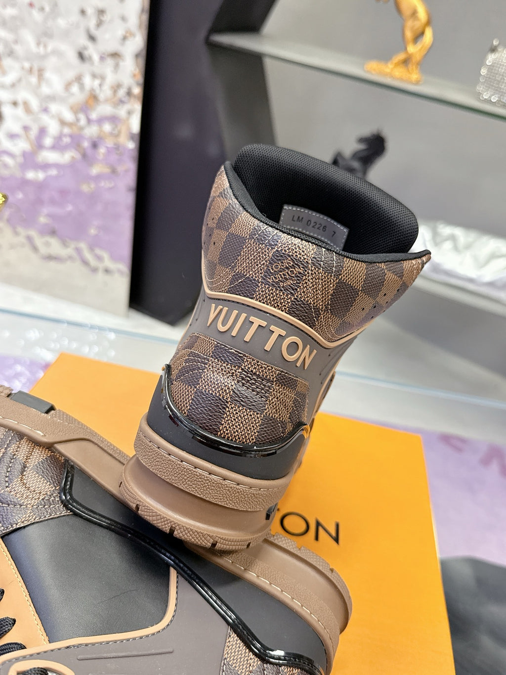 Louis Vuitton ladies high-top sneakers heel view in tan check with black collar