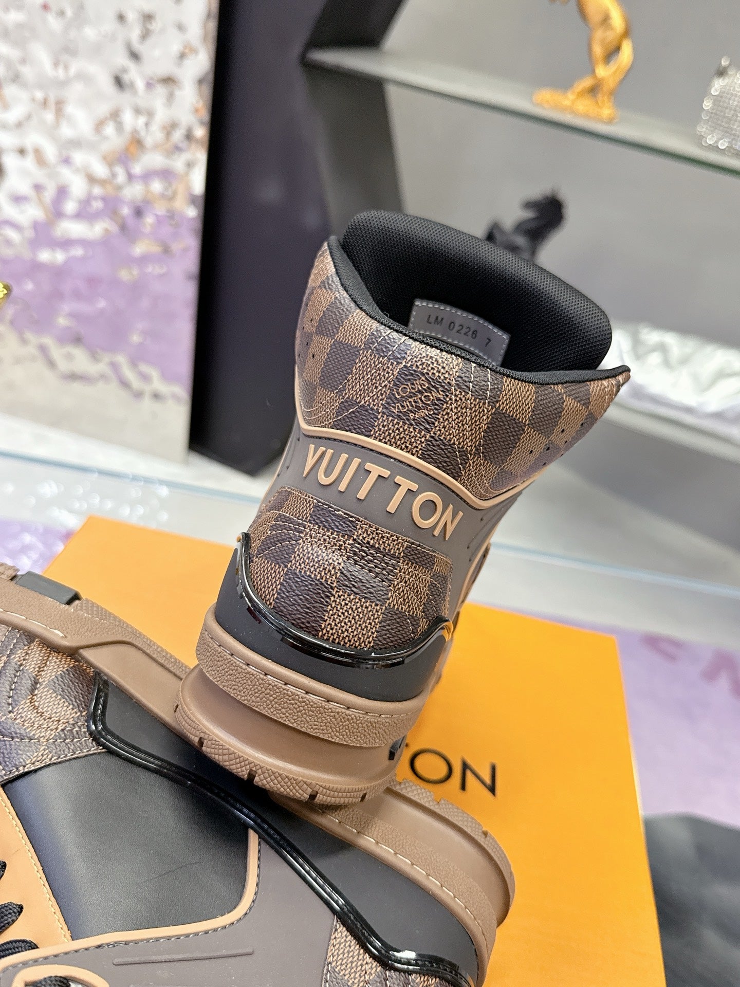 Louis Vuitton ladies high-top sneakers heel view in tan check with black collar