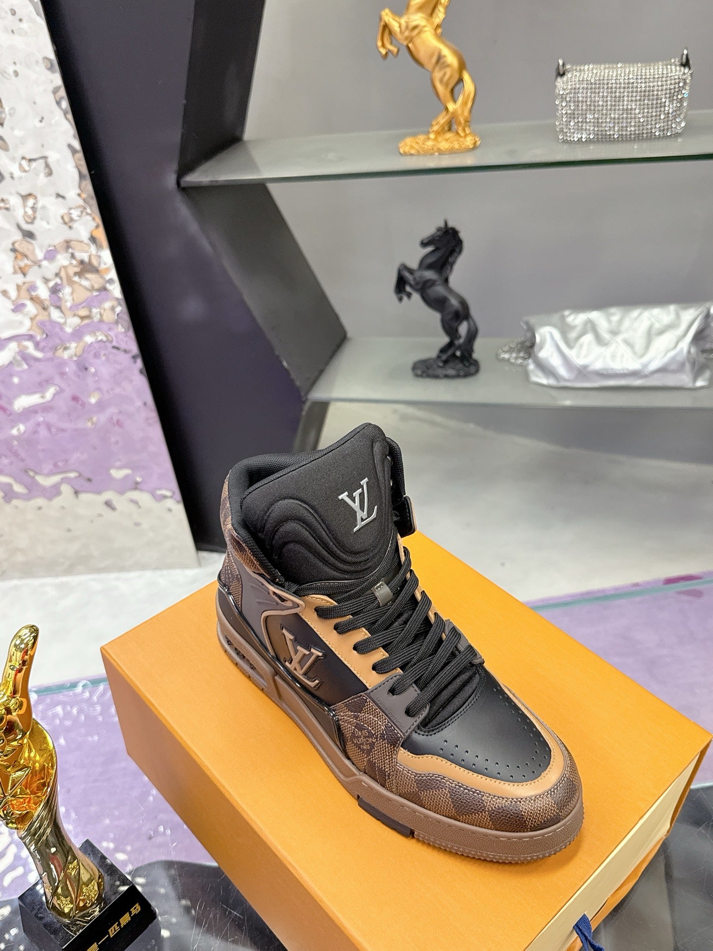 Louis Vuitton ladies high-top sneaker with black tongue and tan patterned side