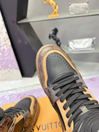 Louis Vuitton ladies high-top sneaker toe in grey with tan edge trim and dark laces