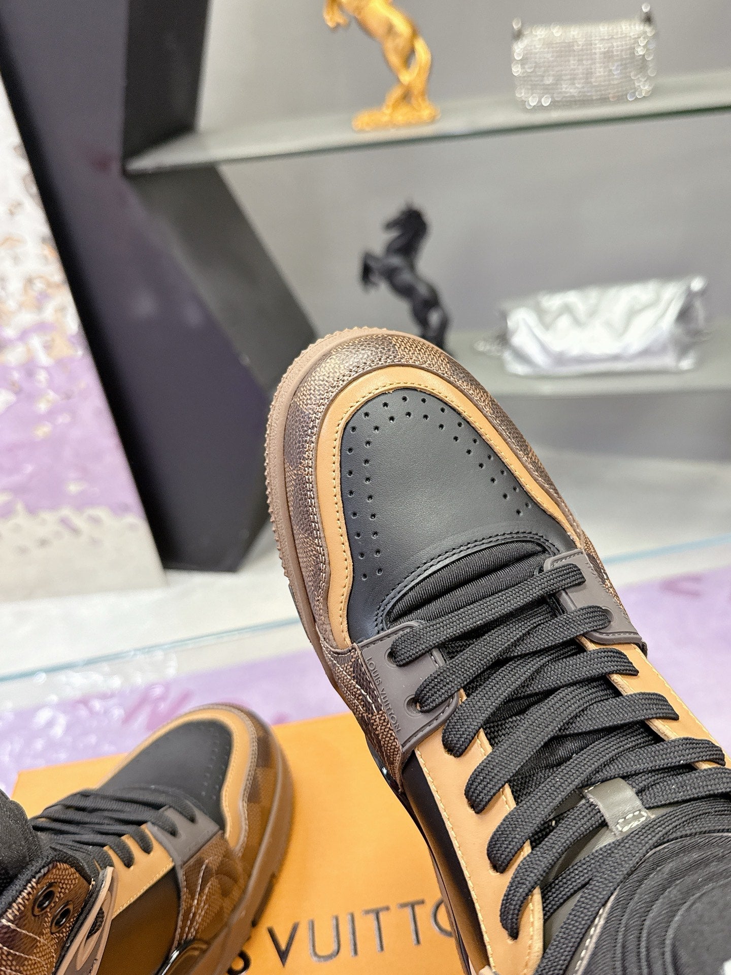 Louis Vuitton ladies high-top sneaker toe in grey with tan edge trim and dark laces