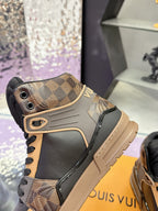 Louis Vuitton ladies high-top sneaker front quarter in tan check pattern with black laces