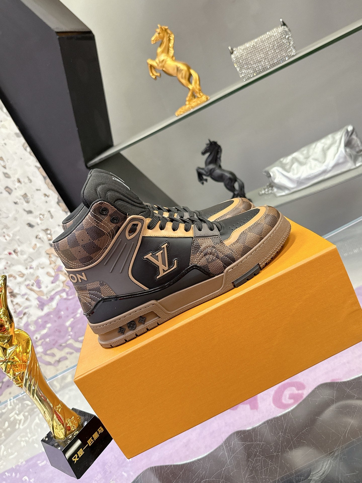 Louis Vuitton ladies high-top sneakers with tan patterned side and lace-up front