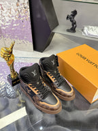 Louis Vuitton ladies high-top sneakers with dark uppers, tan trim, and lace-up details