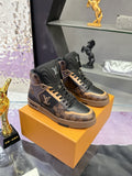 Louis Vuitton ladies high-top sneakers in dark brown and black on display