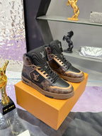 Louis Vuitton ladies high-top sneakers in dark brown and black on display
