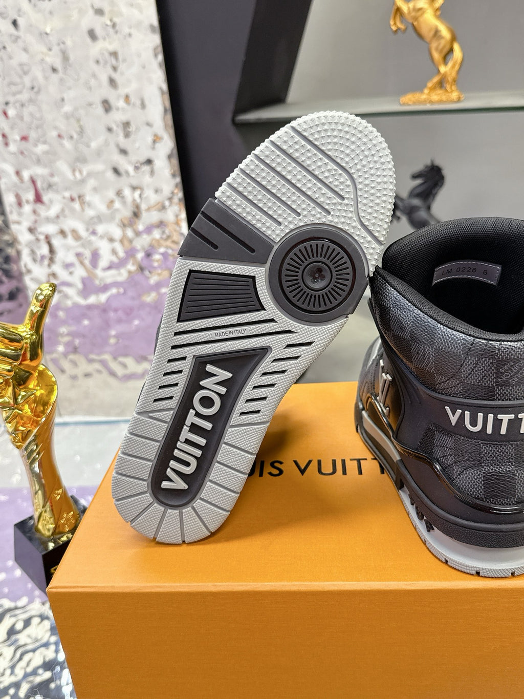 Louis Vuitton sneaker outsole and heel detail, textured tread with “VUITTON” lettering