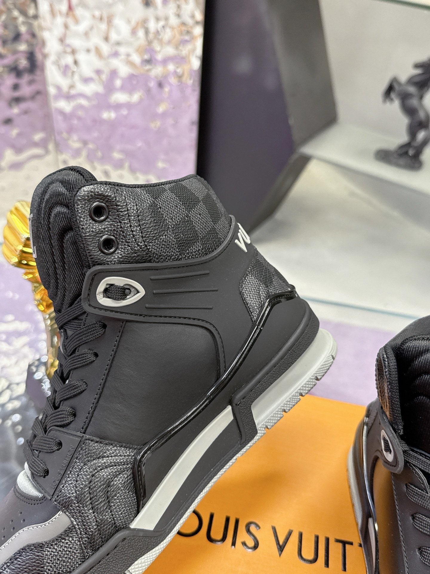 Louis Vuitton high-top sneaker, dark patterned canvas with black leather and side LV logo