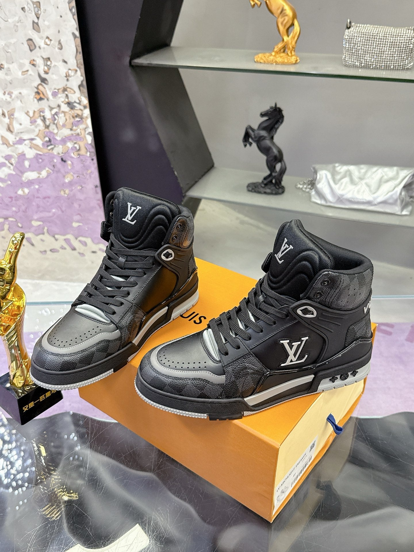 Louis Vuitton high-top sneakers, black with gray toe panels, lace-up design and LV logos