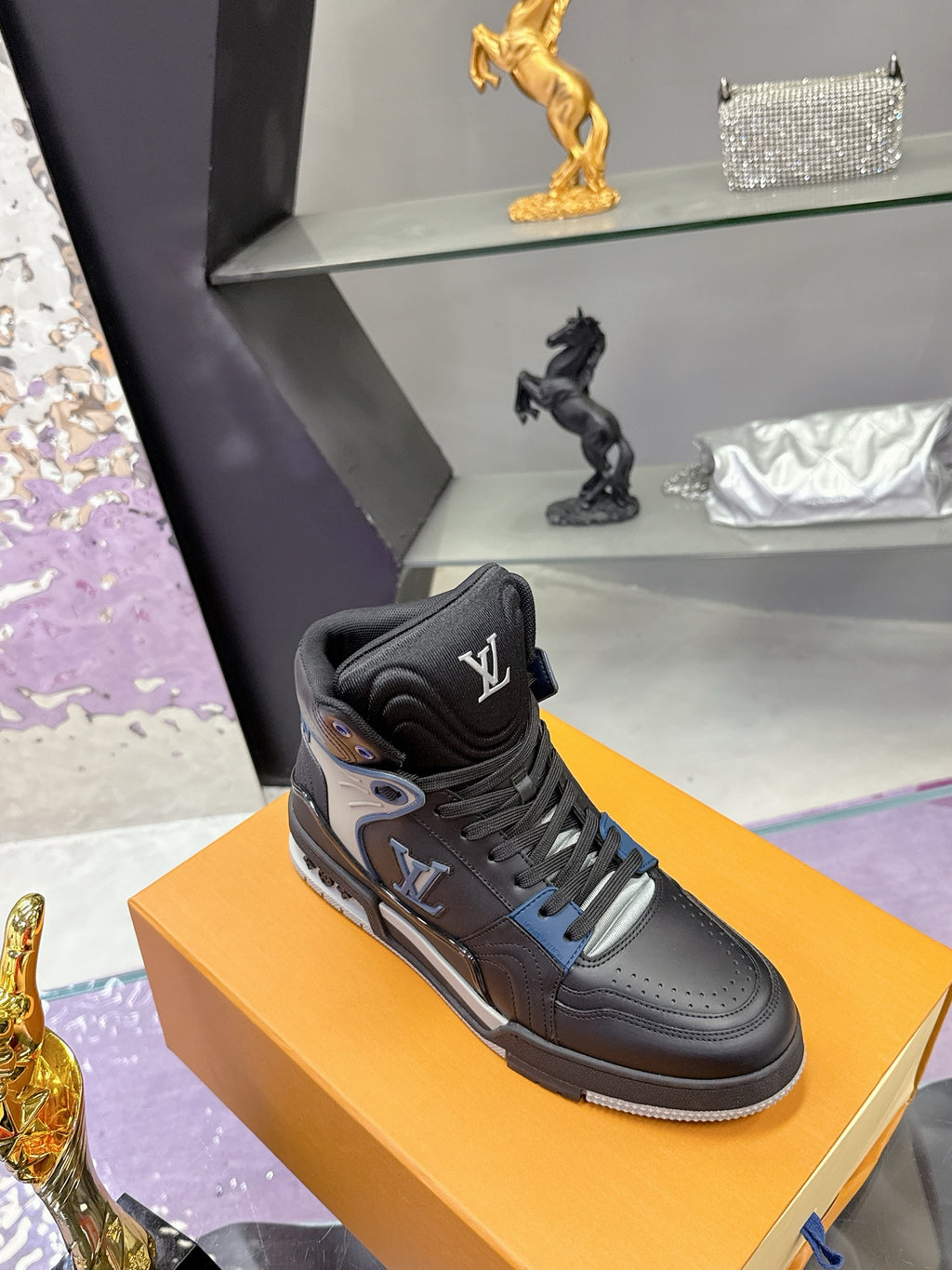 Louis Vuitton high-top sneakers in black with silver-gray toe and blue lace eyelets