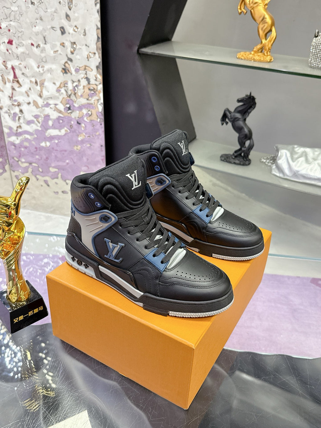 Louis Vuitton high-top sneakers in black with gray panels and blue lace accents