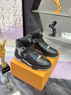 Louis Vuitton high-top sneakers in black with gray panels and blue lace accents