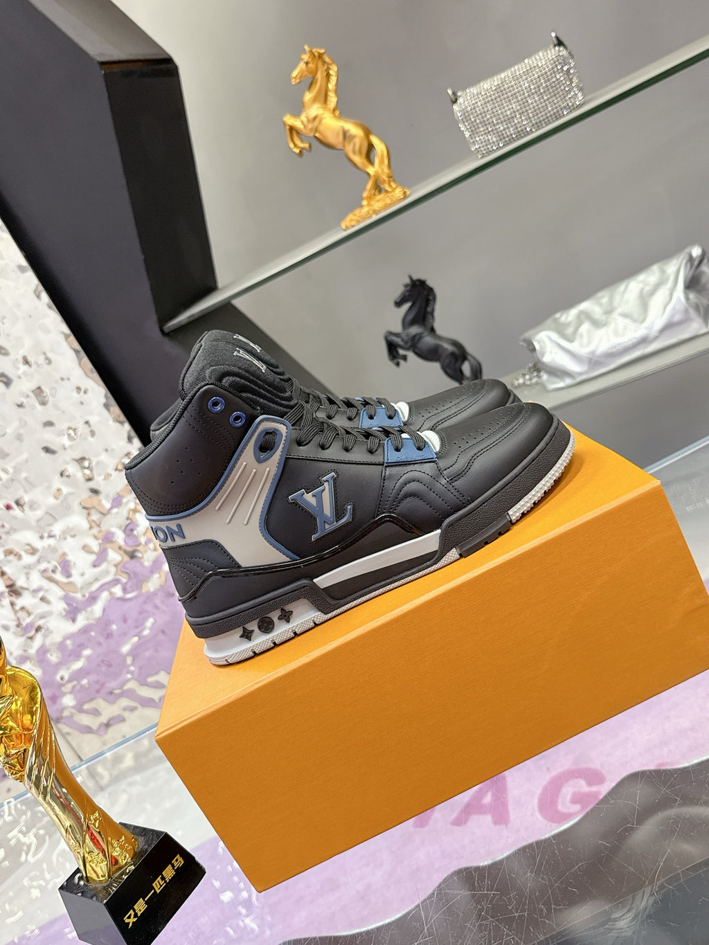 Louis Vuitton high-top sneakers on box, black leather with gray panels and blue laces