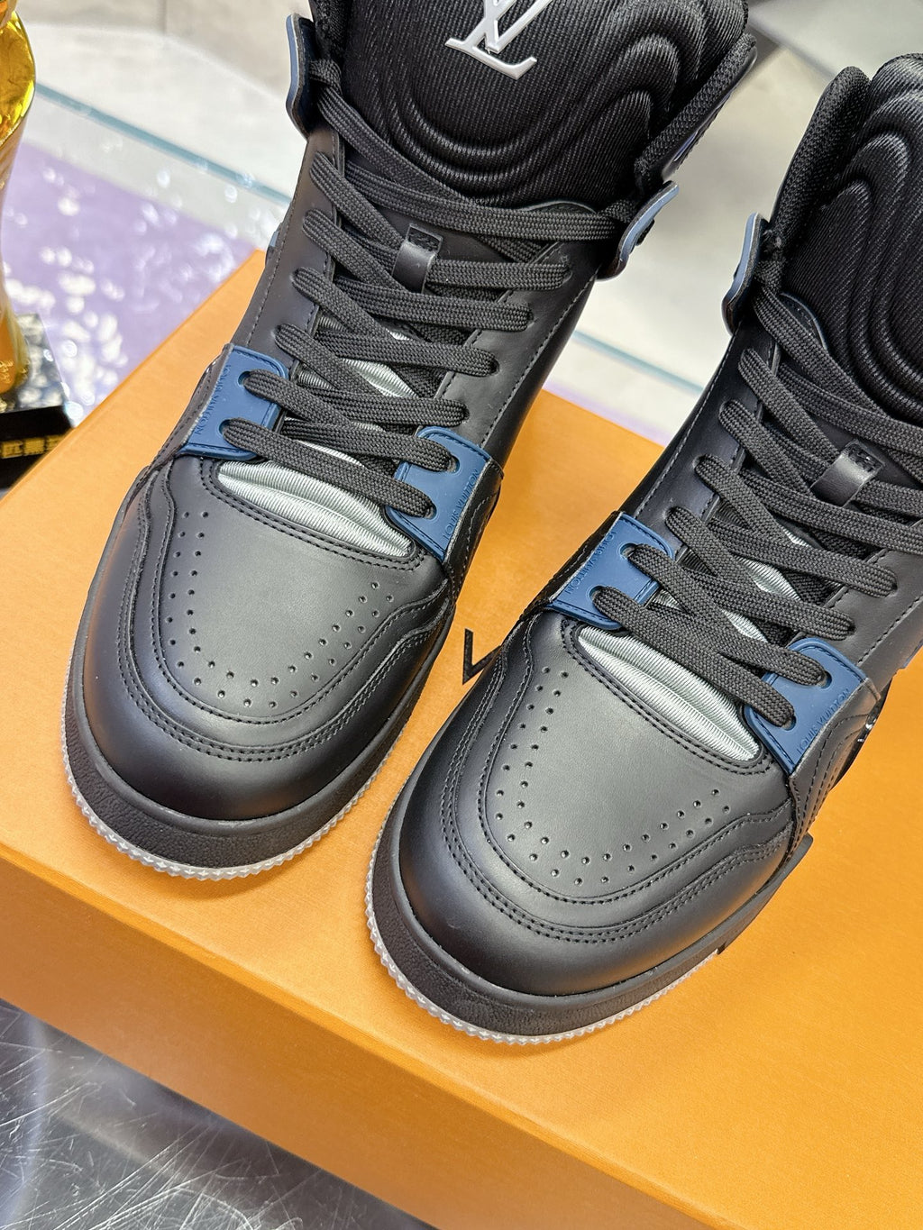 Louis Vuitton high-top sneakers, gray uppers with black overlays and blue lace accents