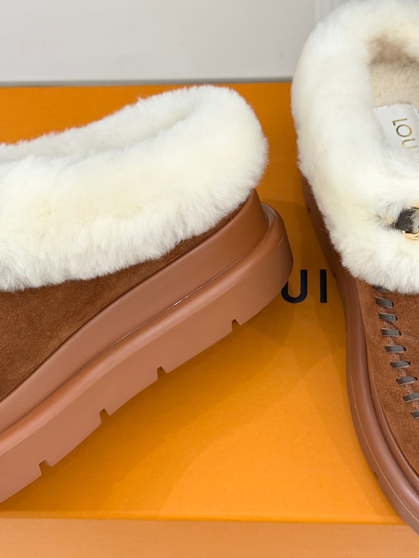 Louis Vuitton women's brown suede slippers with white shearling front and chunky sole