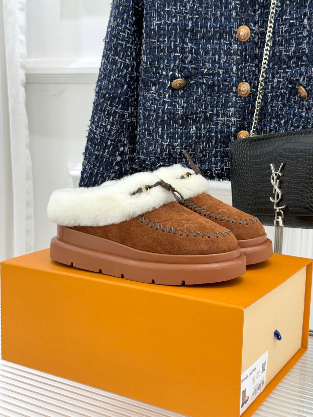 Louis Vuitton women's brown suede slippers with white shearling trim and buckle strap