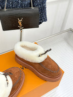 Louis Vuitton women's brown suede slippers with white shearling slide upper and buckle