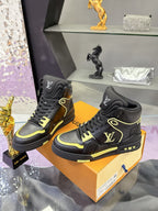 Pair of black high-top sneakers with neon yellow accents and woven laces on box