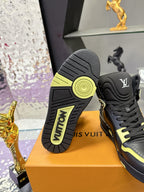 Black high-top sneaker outsole and heel view with neon yellow edge accents