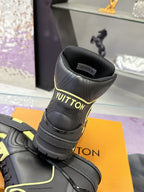 Black high-top sneaker heel with logo print and neon yellow collar stripe