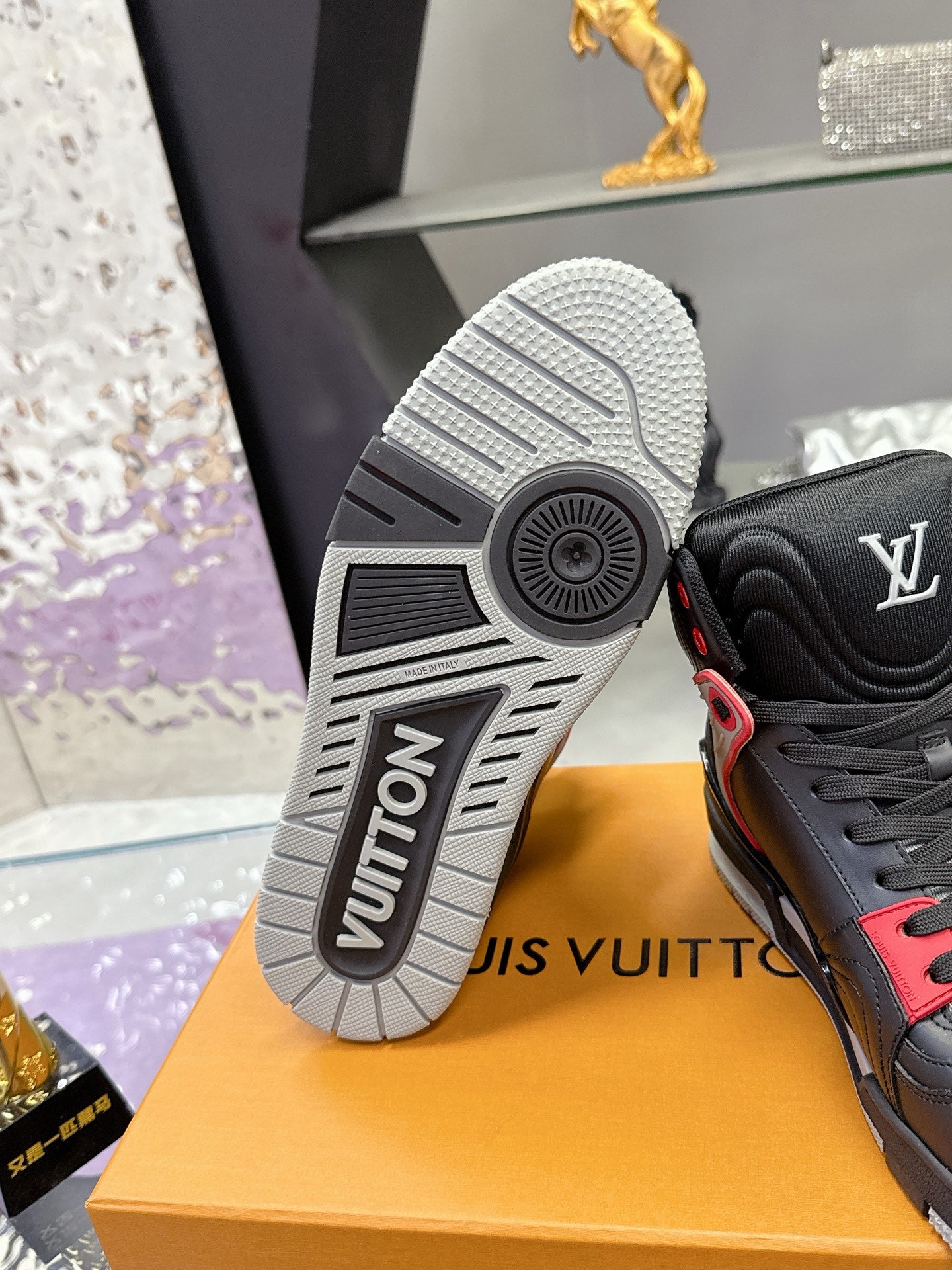 Louis Vuitton sneaker outsole, black upper with red trim and white tread sole