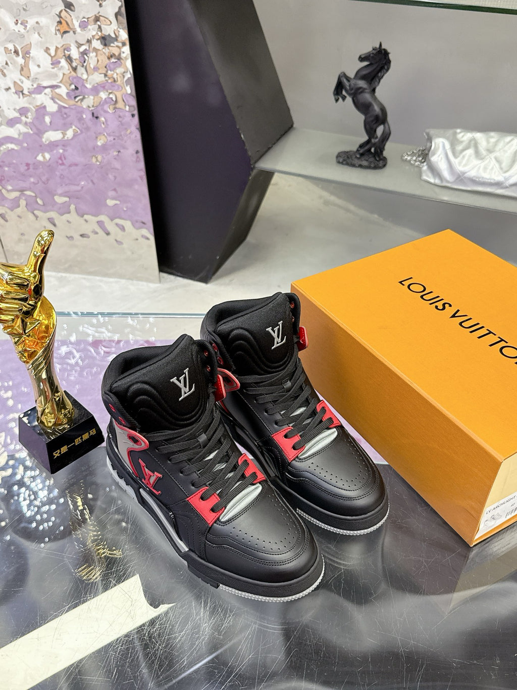 Louis Vuitton high-top sneakers pair, black with red laces and accent trim
