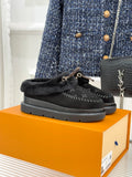 Black Louis Vuitton shearling loafers with monogram canvas and gold-tone bit detail