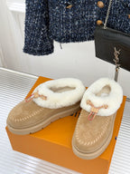 Ladies Louis Vuitton tan suede slip-on shoes with white shearling lining and red strap
