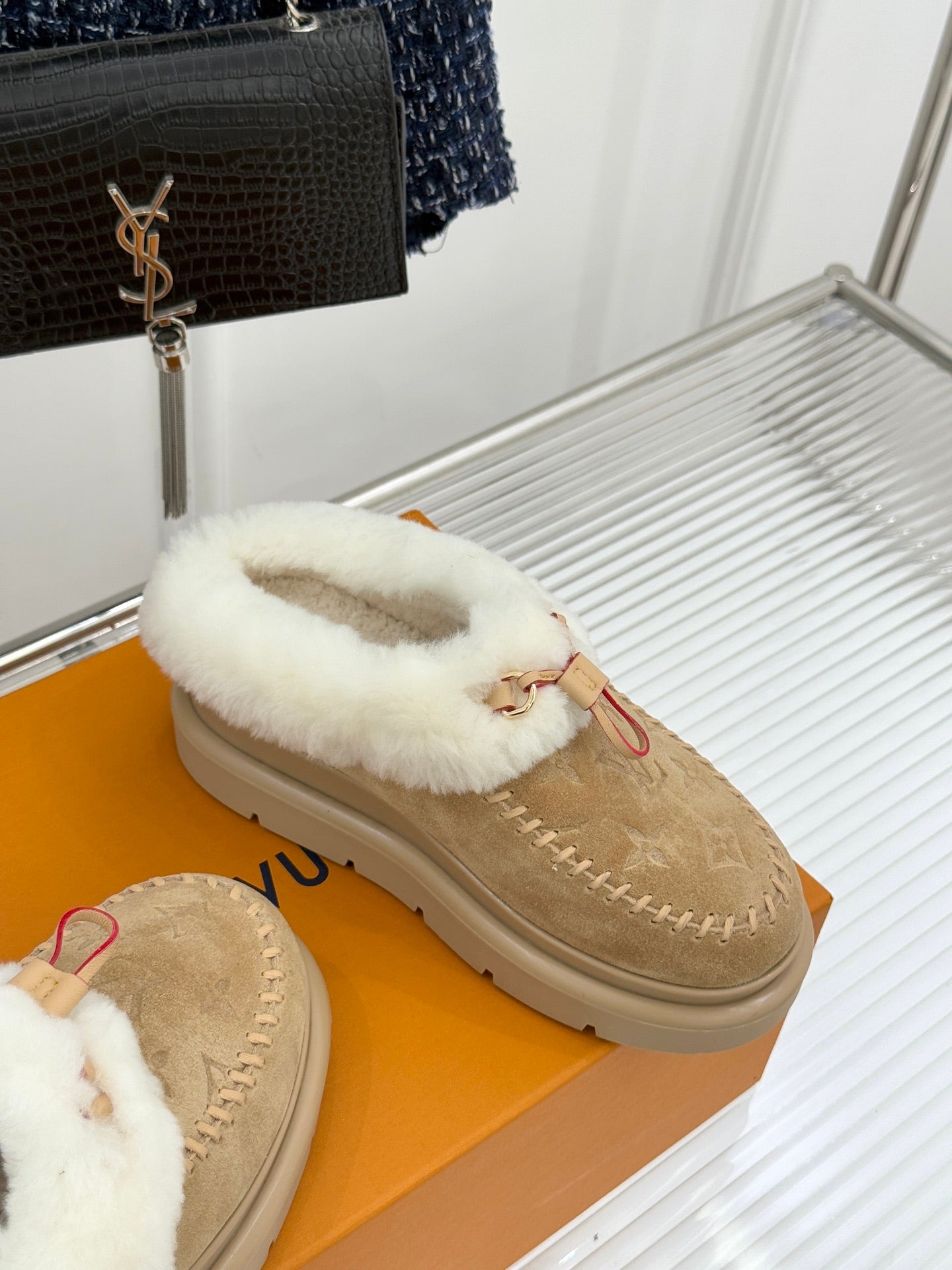 Ladies Louis Vuitton tan suede shearling slip-on shoe with white fur band