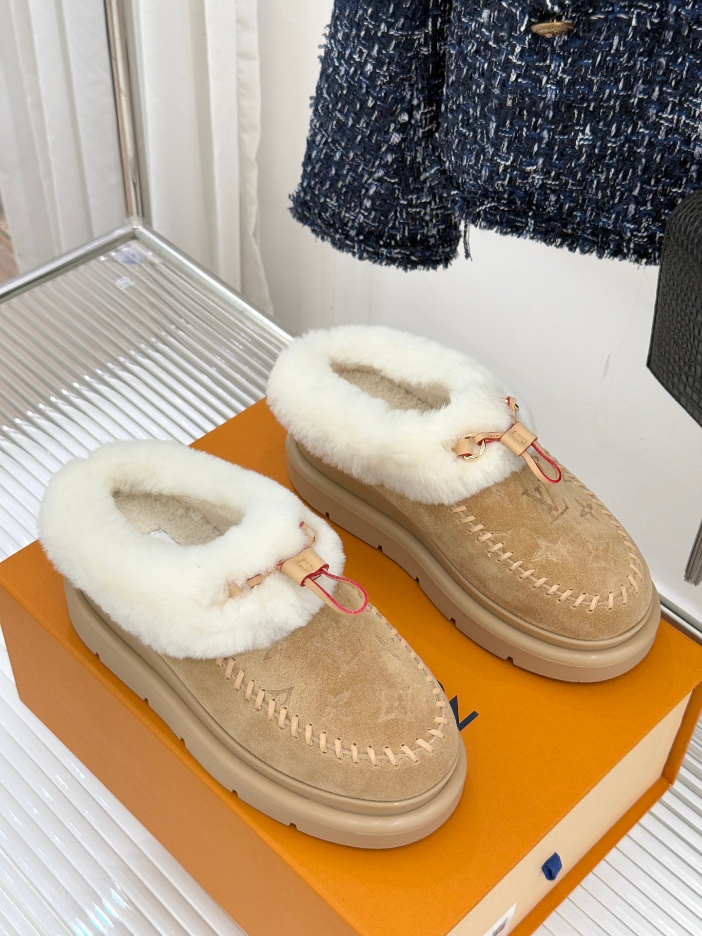 Ladies Louis Vuitton tan suede mules with white shearling strap detail