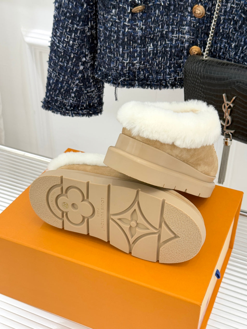 Ladies Louis Vuitton tan suede shearling slip-on shoes, view of rubber sole