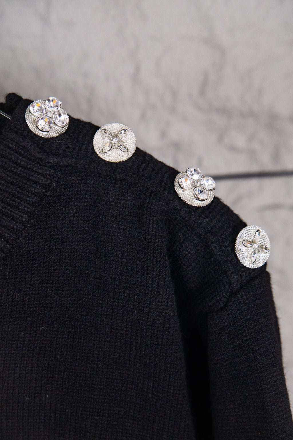 Louis Vuitton black sweater with embellished snap buttons on shoulder
