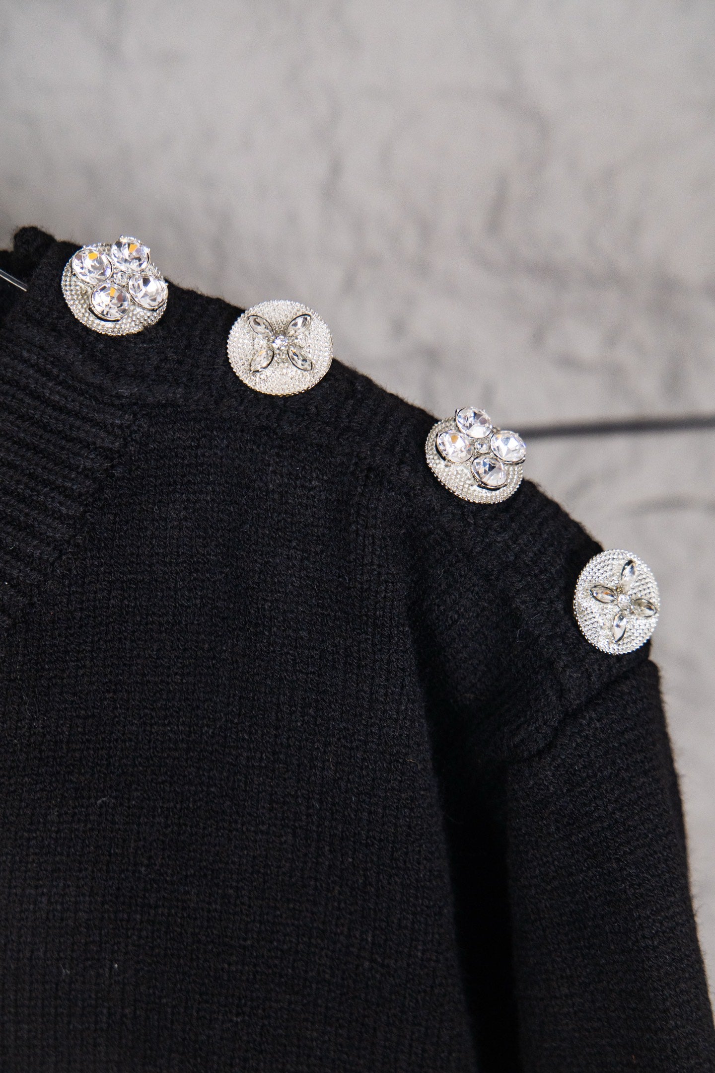 Louis Vuitton black sweater with embellished snap buttons on shoulder