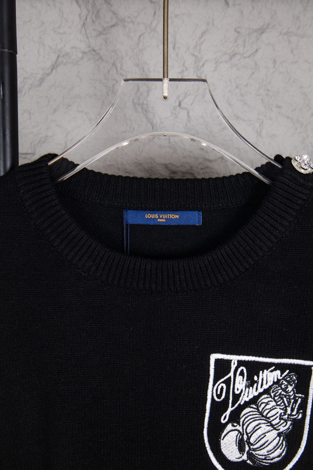 Louis Vuitton black crewneck sweater neckline with crest chest graphic