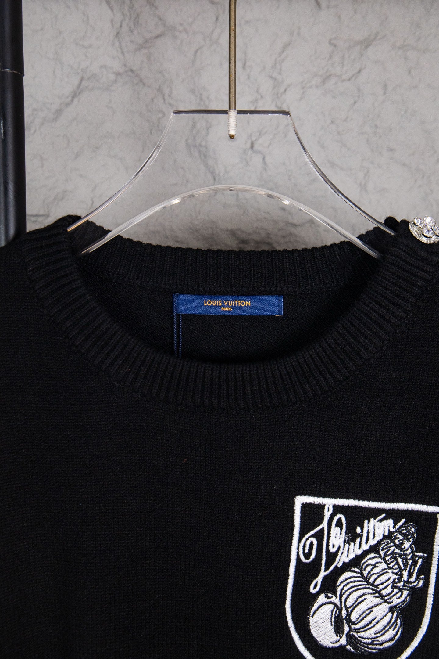 Louis Vuitton black crewneck sweater neckline with crest chest graphic