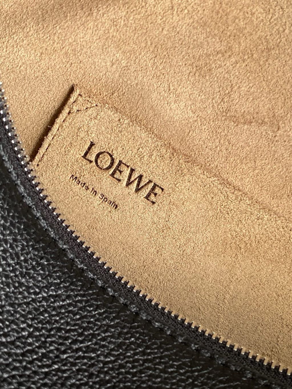 Loewe men's bag lining with 'LOEWE' embossing and 'made in Spain' label