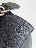 Loewe men's bag logo on textured dark blue leather patch, metal clasp detail